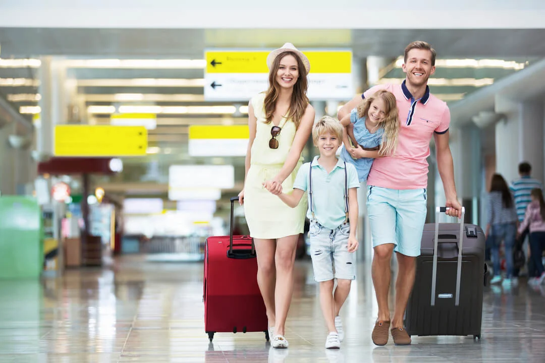 Family of four exiting the airport