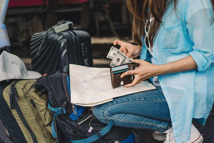 A person going through their travel packed stuff